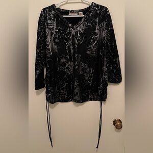 Woman’s blouse, 95% Polyester, 8% spandex, and the brand is Kaktus